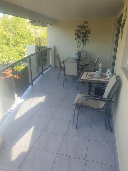 Tiled balcony with outdoor setting