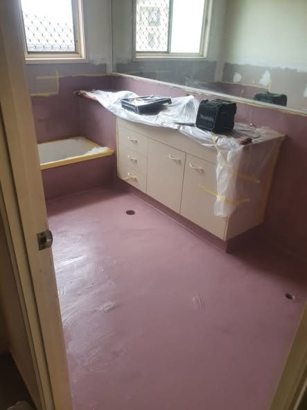 Wet-area waterproofed in pink membrane