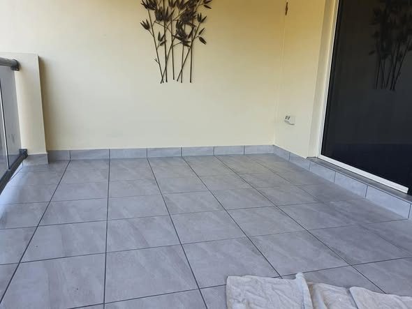Tiled patio over finished waterproofing