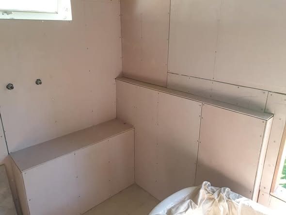 Bare fibre-cement sheeting prepped in a wet-area before membrane
